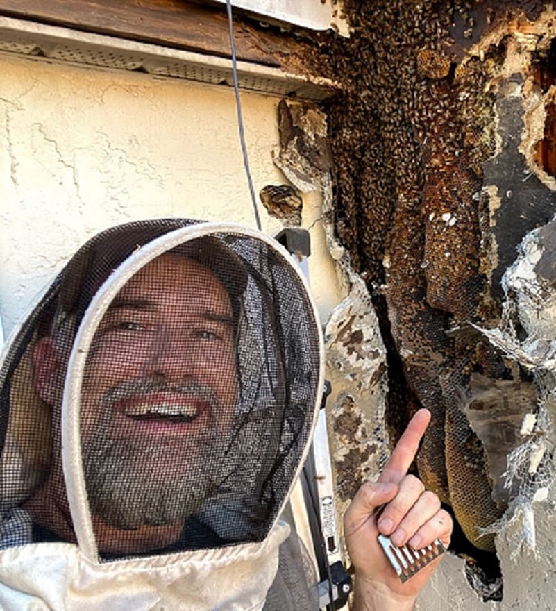 Beekeeper with satisfied customer